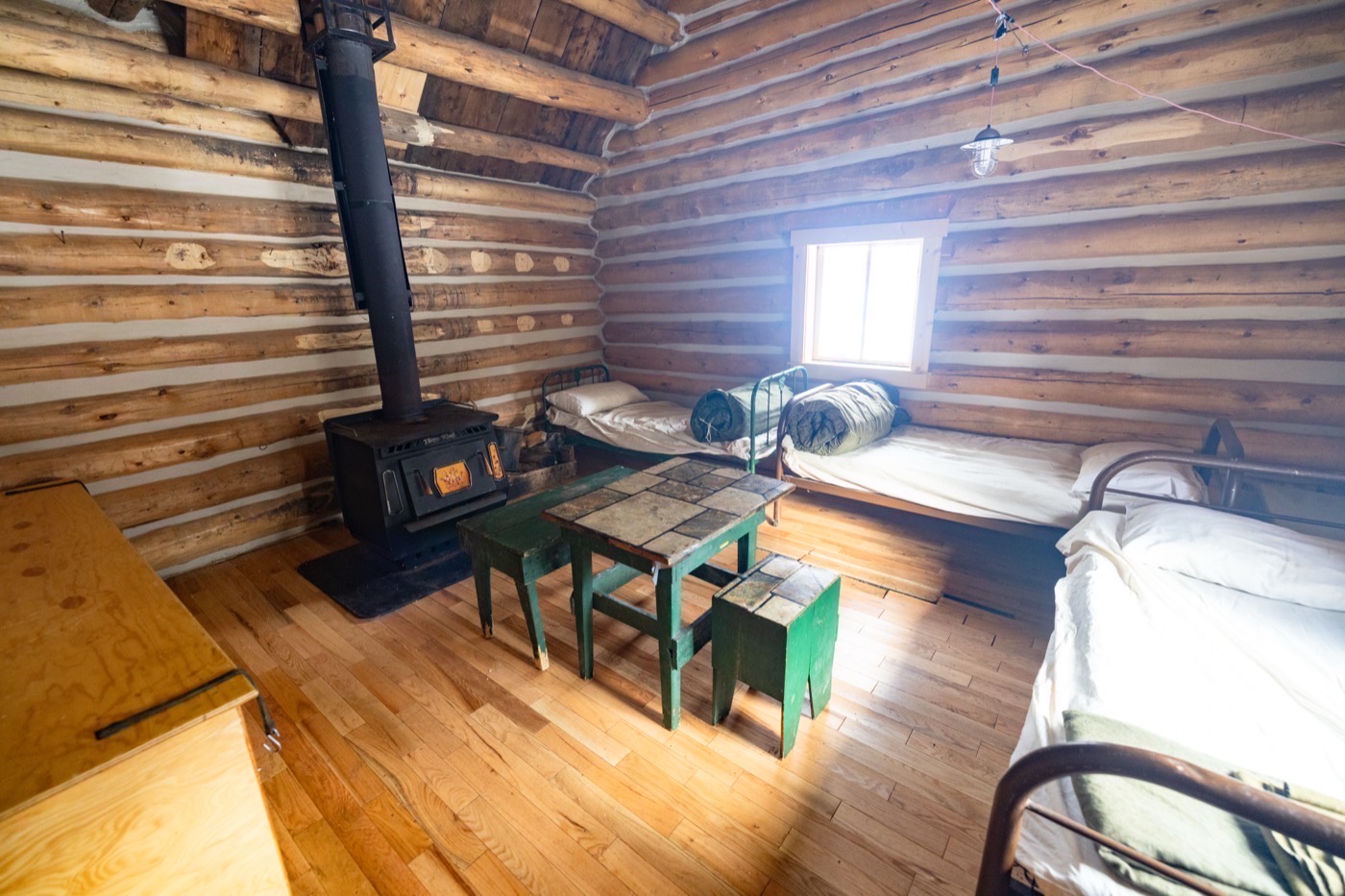 Cabin room with timber walls and morning light